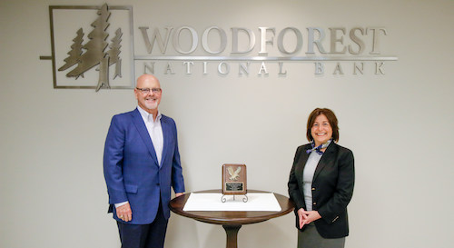 Pictured  with the award is Jay Dreibelbis, President and CEO; and Julie V.  Mayrant President of the Retail Division with Woodforest National Bank.