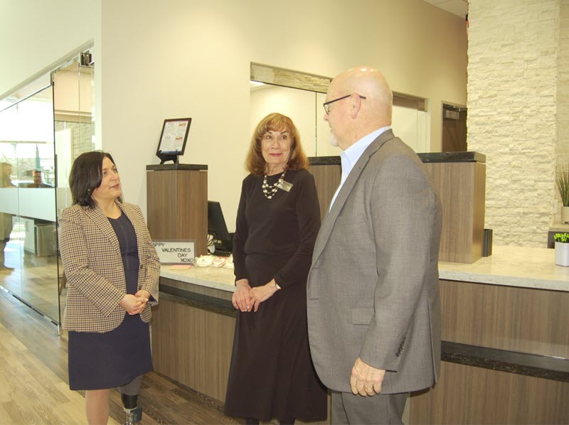 Pictured at the soft opening of the newly re-built Woodforest National Bank building in Downtown Conroe are bank representatives Julie Mayrant, President of Retail Division and Chief Retail Officer; Linda O'Dell, Conroe Downtown Branch Manager; and Jay Dreibelbis, President and CEO. (Photo by Liz Grimm)