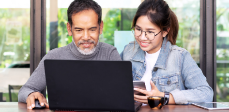 Man and Woman using a laptop